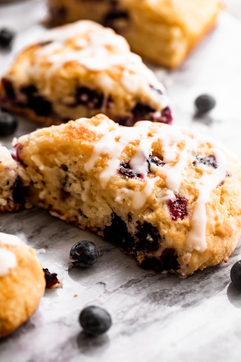 Diethood's tweet photo. Skip the bakery and make these easy Blueberry #Scones at home! Packed with fresh blueberries and topped with crunchy sugar and vanilla glaze, they're perfect for #breakfast, #brunch, or an afternoon coffee break. #coffeecookies #RecipeOfTheDay ➡️ https://t.co/qtzu74O2Ji https://t.co/EDJTAdy3uR