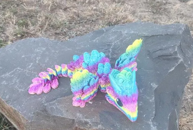 TripleThread3d's tweet photo. Just a majestic Peacock Dragon soaking up some sun on its favorite rock. 🦚✨ Look at that incredible rainbow plumage! 😍🌈🔥 #rainbow #peacockdragon #majestic 
JUST DROPPED on our Etsy shop today!
🎨 Other color options available!
Grab yours here 👇
https://t.co/dPwUuFsuo6 https://t.co/FEqhZr5uM8