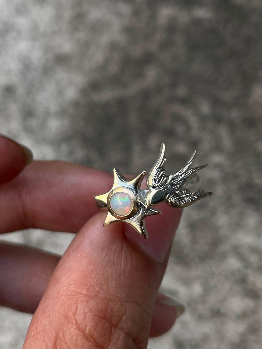 mhaikkun's tweet photo. commissioned my metalsmith friend fakealchemy on ig to make bespoke engagement rings for me and my fiancé! a golden swallow with an opal for me, and a silver dog with a smoky quartz for him 🥰💖 https://t.co/6eOF0xIkXE