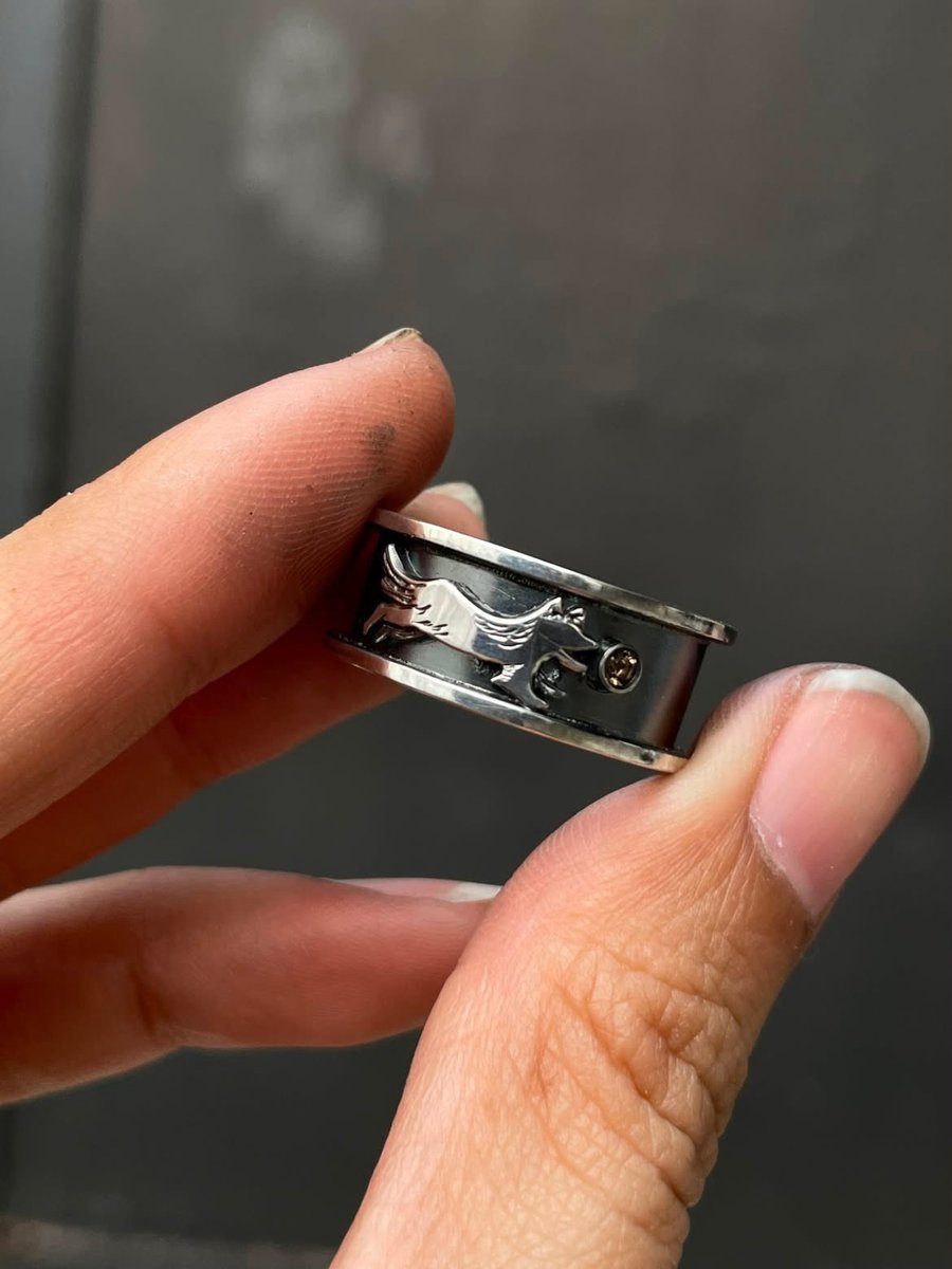 mhaikkun's tweet photo. commissioned my metalsmith friend fakealchemy on ig to make bespoke engagement rings for me and my fiancé! a golden swallow with an opal for me, and a silver dog with a smoky quartz for him 🥰💖 https://t.co/6eOF0xIkXE