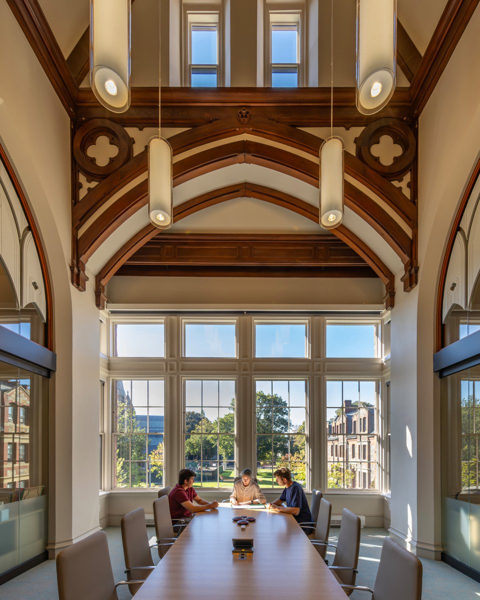 Centerbrook's tweet photo. Interior renovations at @lesley_u removed decades of alterations to reveal original timber trusses, arched openings, and volumetric spaces, restoring a sense of clarity and character. https://t.co/dRdAQwEMoa