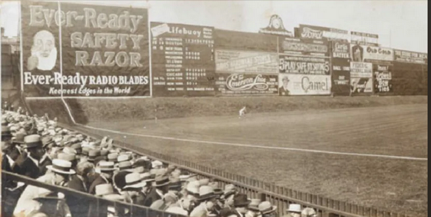 Jimfrombaseball's tweet photo. In 1912, the Boston Red Sox moved into Fenway, which featured a 10-foot high mound that formed an incline in front of the 25-foot left field wall, now better known as the Green Monster.
Duffy Lewis practised catching the ball on the way up the incline and throwing the ball while descending.
He mastered fielding on the incline  to such an extent that it became known as:
"Duffy's Cliff."
Sports cartoons of the period often depicted him as a mountain climber making catches amid sheep and snowcaps.
At the time of his death, Duffy Lewis had no known living relatives and no money,  and was buried in an unmarked grave in Holy Cross Cemetery in Londonderry, just outside of Salem.
In 2001 a collection was taken up to  pay for a headstone, engraving, and upkeep on the plot.