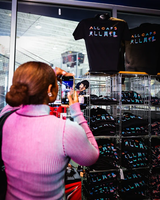 Trap Bob takes photos of her merch on-sale at the MedStar Capitals Iceplex Team Store.