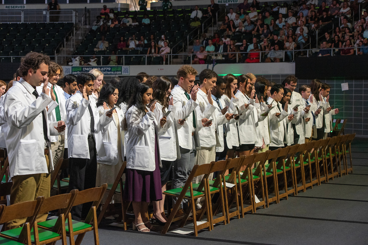 OUHCOM's tweet photo. #TBT to August 2025 when we welcomed the Heritage College Class of 2029 into the osteopathic profession at our Convocation and White Coat Ceremony. In just over a week on Aug. 7, we will welcome the Class of 2030. Learn more: https://t.co/0M7ipshhYw

#OUHCOM50 #ForeverForward https://t.co/vbFSosZhl0