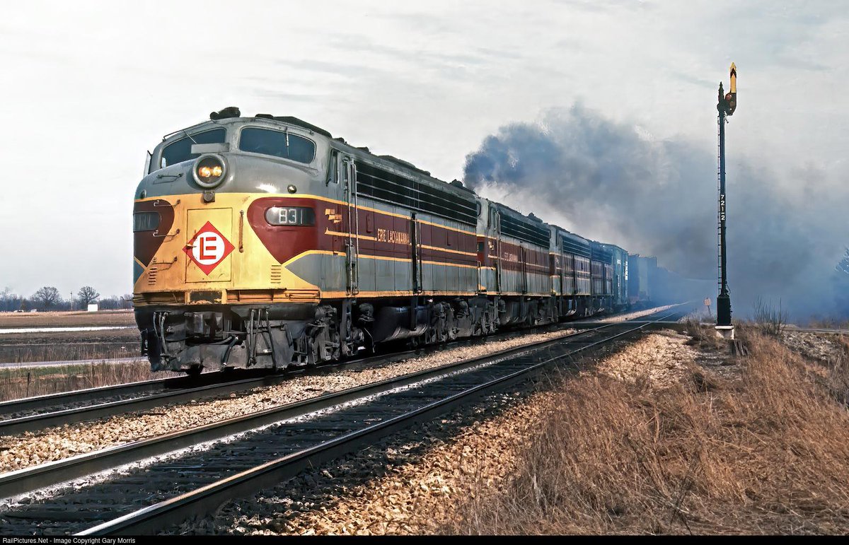 AnthonyTayvk's tweet photo. Despite having been demoted from passenger duties, Erie Lackawanna's EMD E8s are still hard at work in freight capacity in the twilight hours of the Erie Lackawanna. Photographed by Gary Morris somewhere west of Marion, Ohio in March of 1976. https://t.co/wZB1TLAjAb
