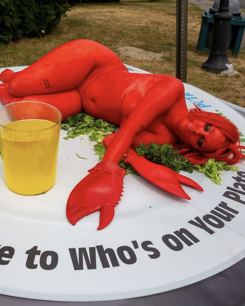 Complex's tweet photo. PETA took its message to Maine’s lobster festival with a dramatic protest stunt, having a woman dress as a lobster and lay on a plate in front of festivalgoers. 

The group called eating lobsters ‘extremely cruel and unnecessary’ and urged people to go vegan.

[📸: via/ PETA, WGME13]