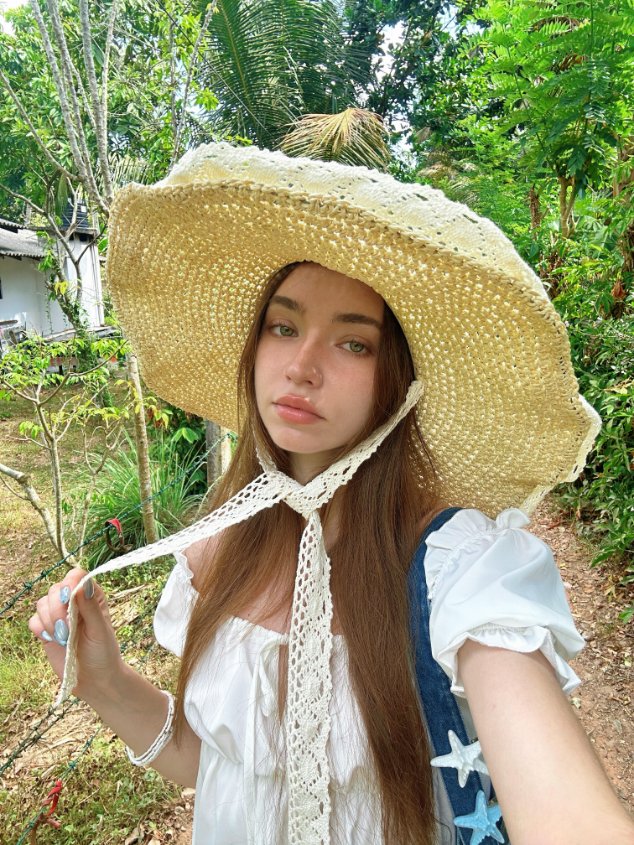 LunarTally's tweet photo. Straw hat on and the whole pace slows down. That deep green of the woods almost dripping with color, wind through the leaves, lace ribbons swaying gently at my shoulders, no rush in any step, like nature is leading the way. Early summer feels quiet, soft, and effortless 🧺🌿 https://t.co/RHox6T5zs6