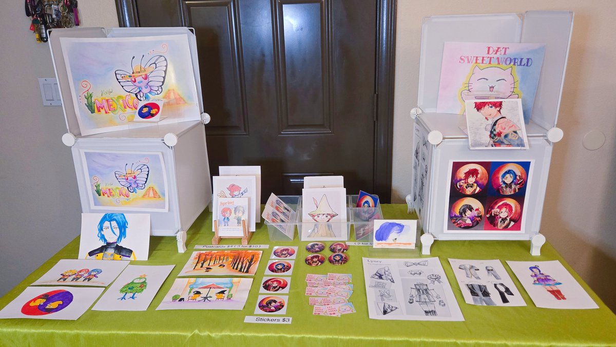 Datsweetworld's tweet photo. I applied to be a Featured Artist at San Diego Anime Con, so I wanted to see what my table might look like. I'm still building my collection, but it was exciting to finally see my watercolor prints displayed together. Fingers crossed!✨️ https://t.co/2PLh13gg8d