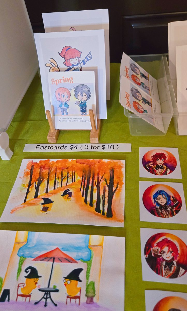 Datsweetworld's tweet photo. I applied to be a Featured Artist at San Diego Anime Con, so I wanted to see what my table might look like. I'm still building my collection, but it was exciting to finally see my watercolor prints displayed together. Fingers crossed!✨️ https://t.co/2PLh13gg8d