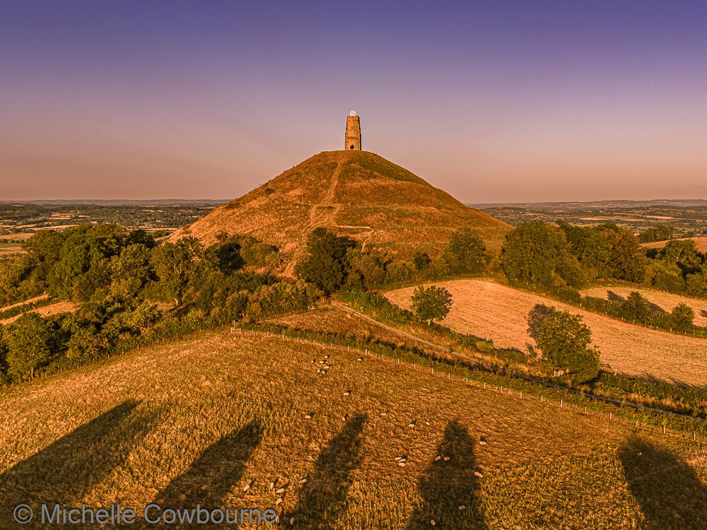 Glastomichelle's tweet photo. The moon having a rest on St Michael's tower at sunrise this morning. I took too many photos of both moonset and sunrise this morning so more to follow hopefully when I have had time to work through them all. 😂 https://t.co/S3wX8EvFga