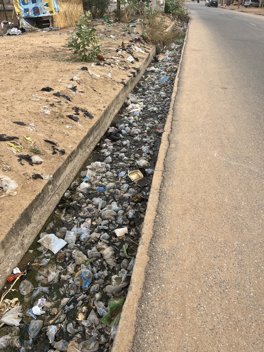 aliyuyahas's tweet photo. For a struggling state like Yobe grappling with inadequate basic amenities, a N22bn flyover and a N19b (and growing) airport are not the most efficient utilisation of resources, to say the least. 

A city doesn’t require a needless flyover to be aesthetically pleasing. I can’t recall ever spending more than 5mins at the location where the flyover was built. I guess there were no traffic studies or congestion data to justify the project. It seemed to have been built purely for aesthetics (and likely kickbacks). 

Perhaps you could allocate less than 5% of that amount to improving the state cleanliness instead. Many of Damaturu’s drains are blocked and unkempt. The pictures below is Don Etiebet, the governors’ neighbourhood, that I snapped 2 years ago. Nothing much has changed. 

Strategically deploying N40bn without kickbacks into a sector where the state already has a competitive advantage would have delivered far greater returns, both long and short term. Better still, channel it into a sector like Education where the state competes for the bottom 10 states. Better better still, revive the few moribund state-owned companies like Dofarga, Flour mills, Sahel Aluminum, Polythelene & sacks, Yobe Fertilizer and the likes. 

This cargo airport project started in 2017 and became a conduit for siphoning public funds. The last governor “upgraded” the airport with N6bn six days before he left office after the initial N11.3bn project cost. There was a “revitalisation and airhub enhancement with environmental beautification” upgrade just last year. The state governor still wants to “remodel” the airport few months before he leaves after several upgrades.

Since its commissioning 3 years ago, the upgraded, revitalised airport and now set to be remodelled, has not recorded a single commercial flight and you can count the landings on your fingertips, most of them by the governor’s private jet and his associates.

This is akin to a man struggling with a leaking roof but chose to paint his apartment for the aesthetics.