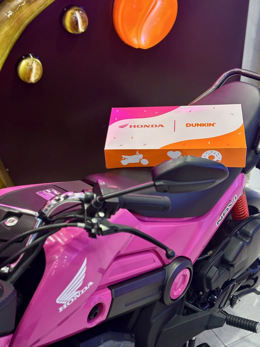 dunkinph's tweet photo. Dunkin’ PH and Honda are teaming up to make every new ride even sweeter! 🏍️🍩

Customers who purchase a Honda NAVi will bring home a Dunkin’ voucher for 8 Classic Donuts! Available at participating stores nationwide. Promo runs until October 27, 2026. 

#DunkinPHxHonda #PasalubongNgBayan