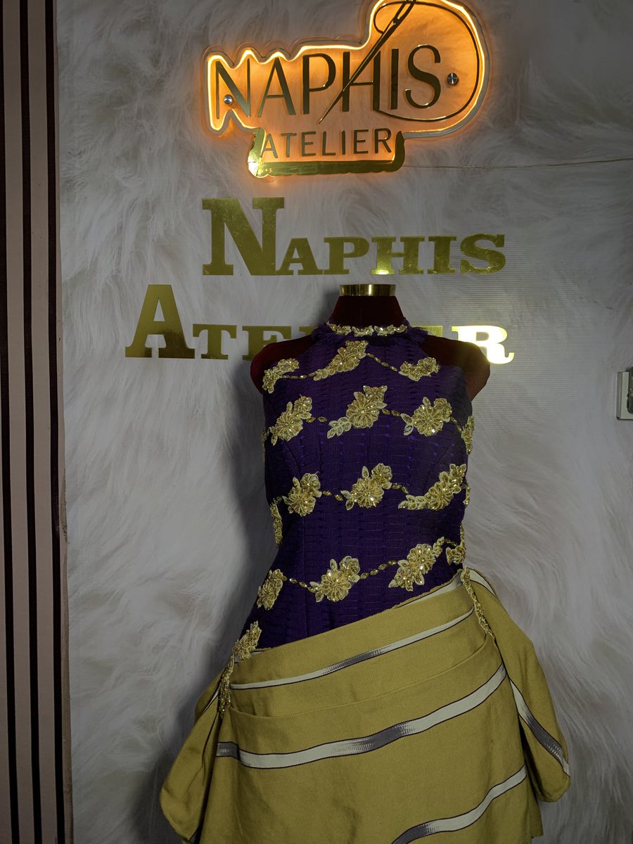 naphisofficial's tweet photo. Two Aso-Oke, One dress. 

Crafted with rich purple Àṣọ Òkè and patterned handwoven Àṣọ Òkè accents, this piece is thoughtfully designed with intricate gold applique and gem studs that catch the light with every movement.

A fusion of tradition and elegance, it honors the beauty of African craftsmanship while embracing a contemporary silhouette. Every detail speaks of culture, artistry, and the confidence of a woman who wears her heritage proudly.