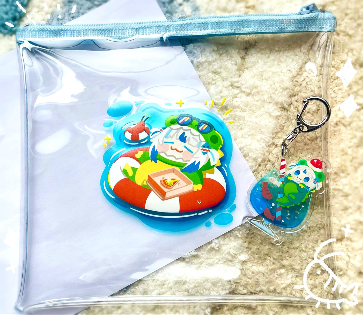 sameanko's tweet photo. 夏コミ新刊セットのクリアポーチと
アクキーが届きました！🌊🛟🦈✨

涼しげで夏らしく、かわいく仕上がって良い感じ…！
新刊とステッカーも詰めてセットで頒布予定です🙌
#C108 https://t.co/J7JhG5EhsZ