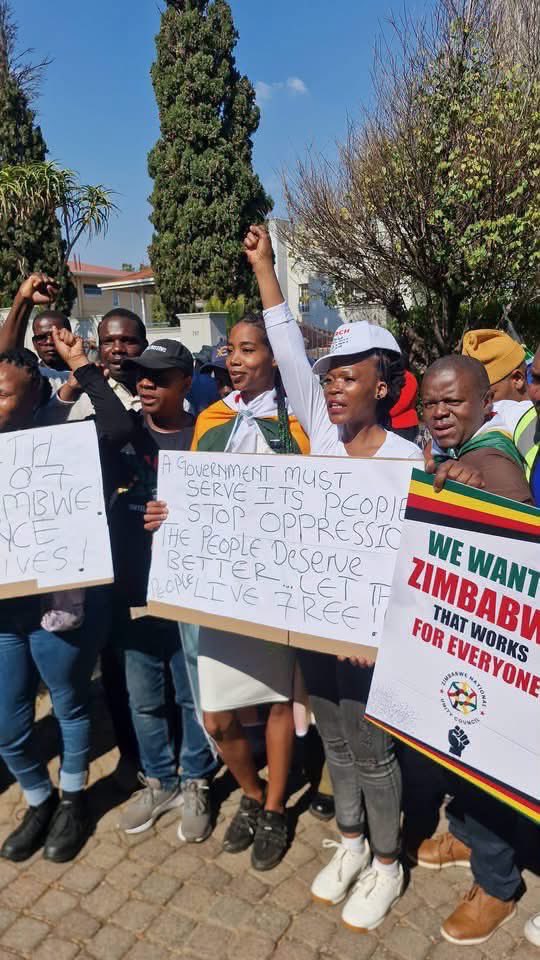 JacintaNgobese's tweet photo. Today the “Xenophobic” March and March, Operation Dudula and other civic movements and patriots! Stood alongside a very few Zimbabweans outside the Zimbabwean Embassy to demand that the Government of Zimbabwe treats its own people better so they don’t flood to South Africa because of their own governments failures‼️‼️
