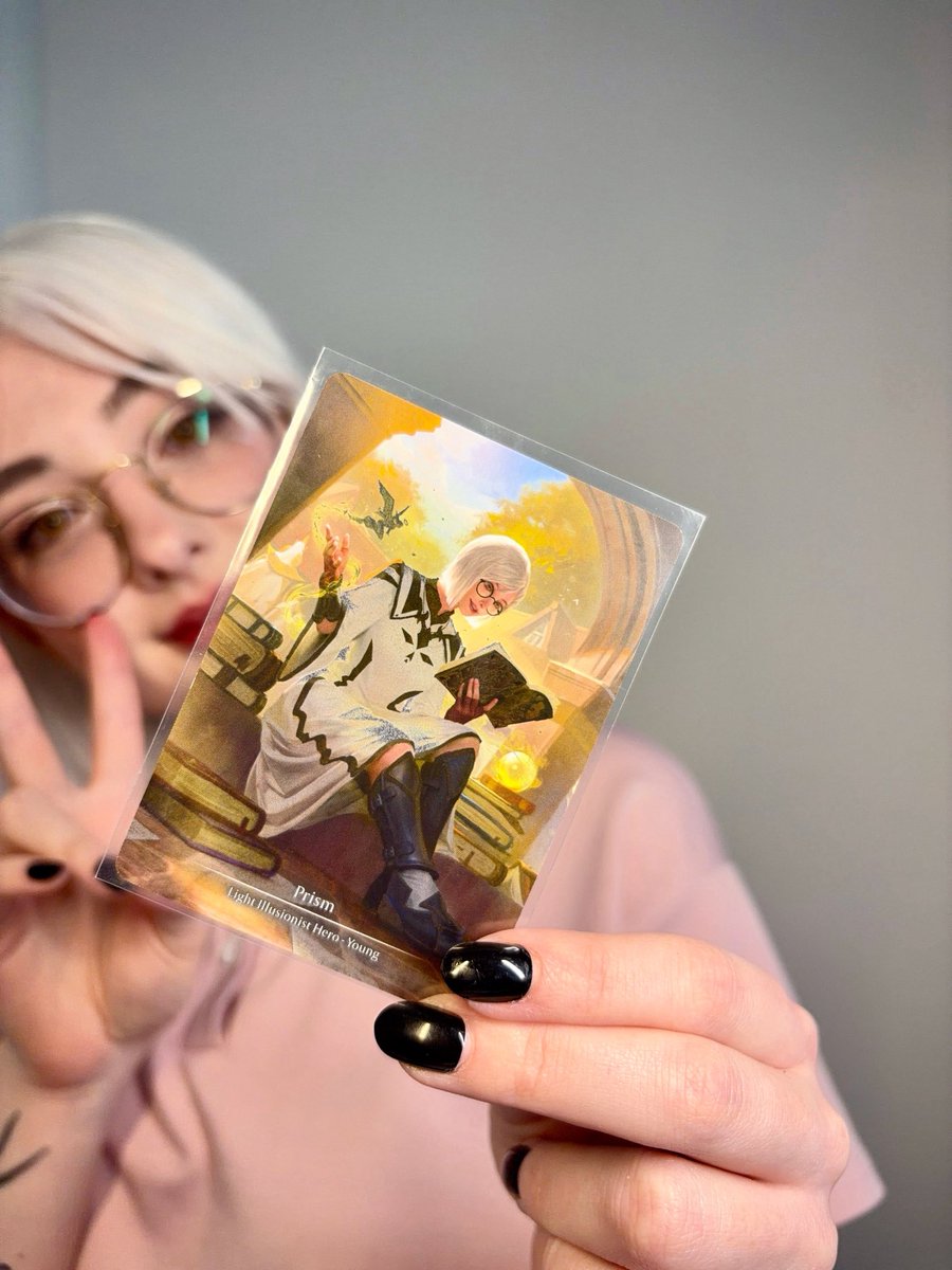TheThreadedRen's tweet photo. Some cards mean more than just what they do in-game. Young Prism is one of those for me. She was the cosplay I brought to the Compendium World Premiere in London, and she's the hero that caught my eye when I came to Flesh and Blood from MTG. I have Marvels that I play with more, but this one will always be special. #fabtcg #fabcw