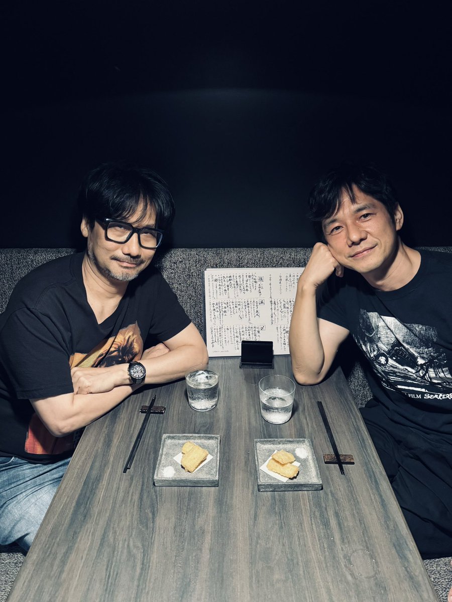 HIDEO_KOJIMA_EN's tweet photo. The “Shima-Hide Meeting,” Summer ☀️
Today’s T-shirt showdown:
“Sorcerer” vs. “E.T.”
With Hidetoshi Nishijima. https://t.co/H7vqBsCWH2