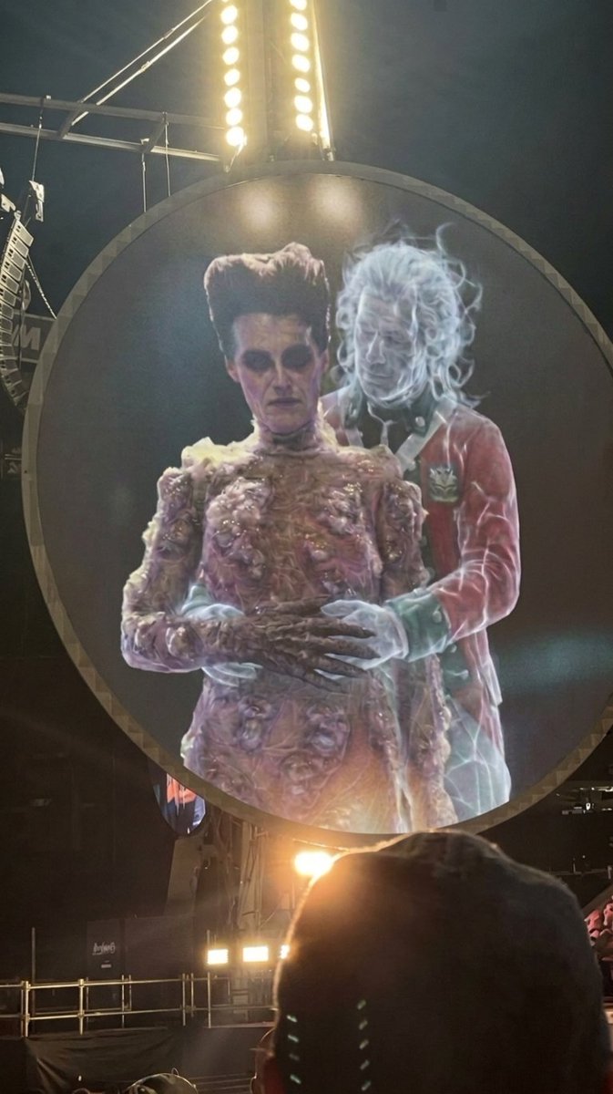 Dan_G_Ross's tweet photo. @bear_ing No update yet on the status of Rebekah and the goth chick. There seems to be trouble in paradise though as Rupert was recently caught on the big screen at a Coldplay concert getting a little too cozy with Gozer. https://t.co/TtLf33s1bk