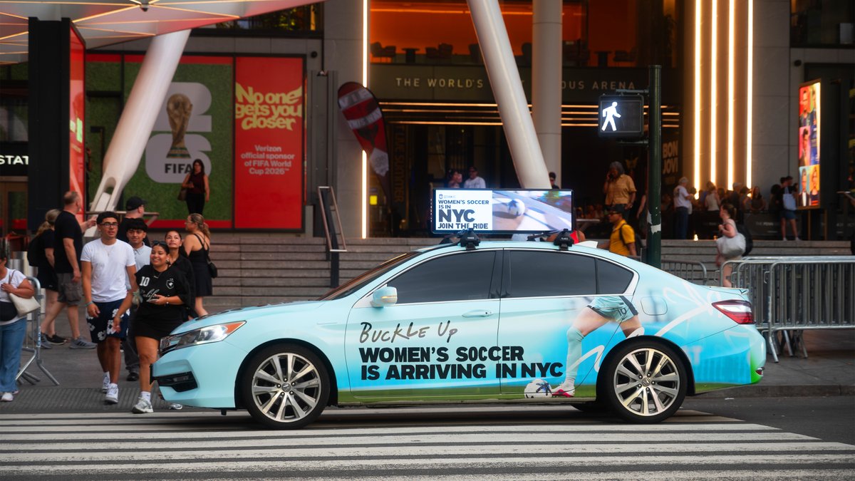Firefly_Cities's tweet photo. Buckle up. Women’s soccer is arriving in NYC. ⚽🗽

To mark @GothamFC’s historic move to Etihad Park in Queens in 2028, digital tops and wrapped cars brought the announcement across New York.

New city. New home. Gotham FC is on the move.

#Firefly #OOH #DOOH #GothamFC https://t.co/b26VMjFGEG
