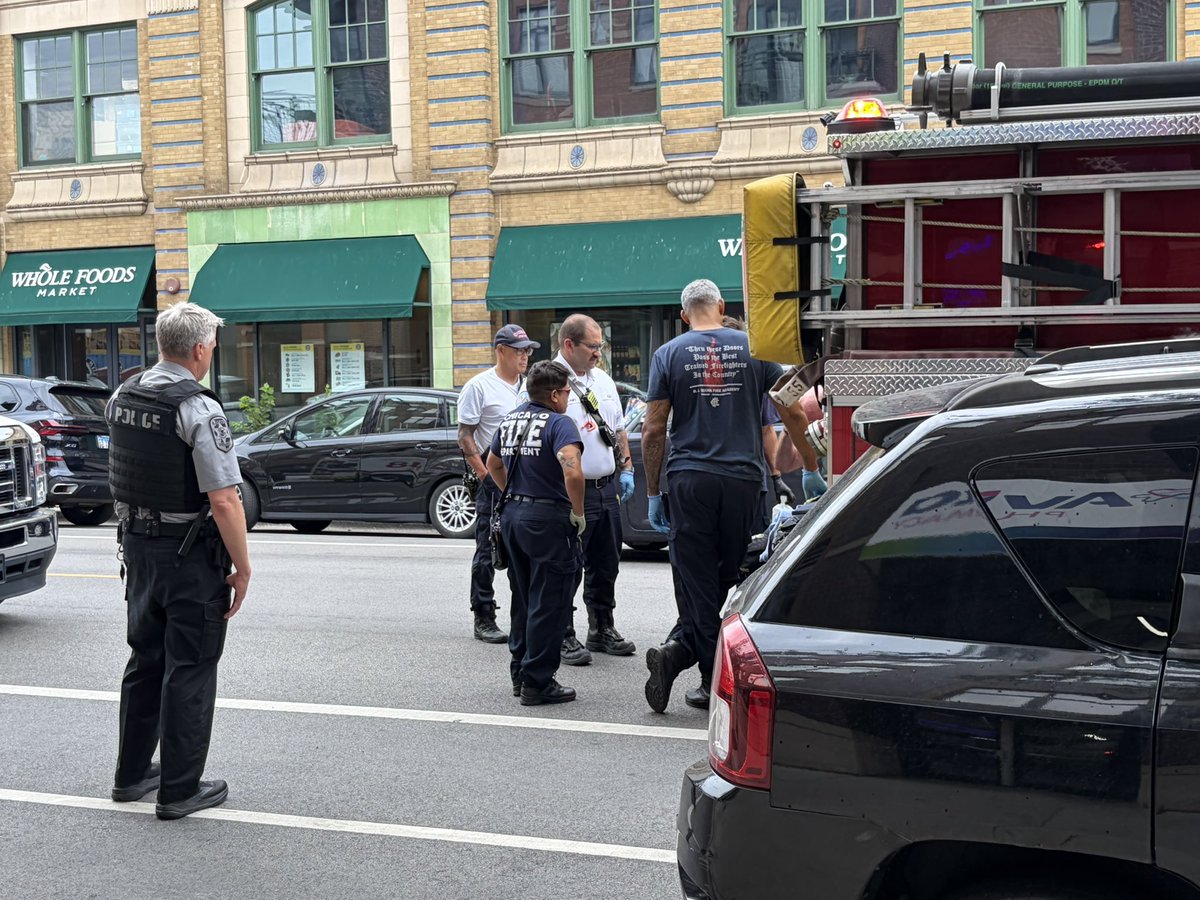publicpolicyman's tweet photo. An older man on a bike got in an altercation with a couple in an SUV who allegedly maced him.   This was at 1:30pm at 3640 N Halsted across from Whole Foods and 2 blocks east of Wrigjey Fiekd where the Cubs are playing the Yankees right now. The SUV drove off as the bike rider sat on the curb unable to see. 

Two citizens walking helped  the man. 911 was called with a firetruck then an ambulance arriving who administered first aid. The man was ok after flushing his face with water by EMTs. After that they waited 30 minutes but no Chicago Police car arrived to file a report. One witness wrote down the license plate while another had some video of the incident. 

A Police unit was flagged down who was part of the event detail for the Cubs game who filed the report, @CWBChicago @SubxNews @CPDscannerZone4