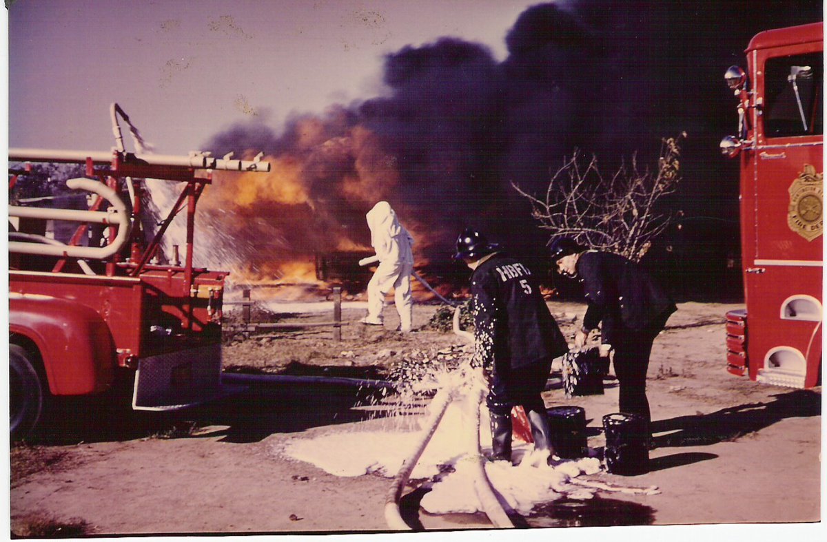HBFD_PIO's tweet photo. Flashback Friday: A look back at Huntington Beach Fire Department history. This historic photo captures firefighters battling a major fire using early foam operations and protective equipment. Do you recognize this incident or know when it happened? 

#FlashbackFriday #HBFD https://t.co/g4xDrssdwf