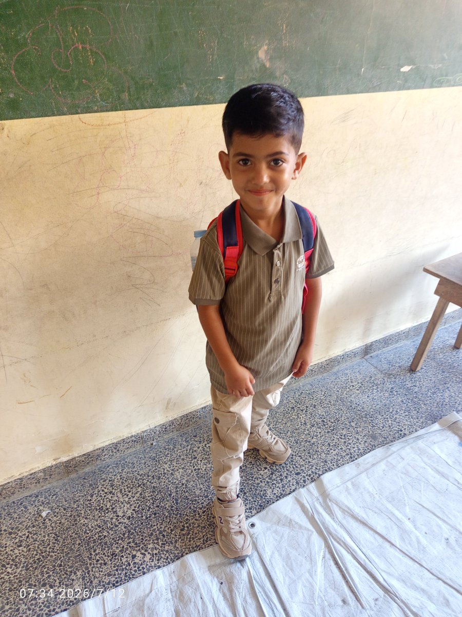 mohammedIhysse's tweet photo. I took this photo of my son, Emad, on his very first day at school. He was incredibly happy because he was finally able to begin his education.

I walked with him for 2 kilometers to take him to his school. When we reached the school gate, I asked him, "Are you tired from the walk?" He looked at me and said, "Not at all. I will walk to school every day. I am so happy, Dad. My dream has finally come true." 💔

Let the world know that all the schools in Gaza have been destroyed during the war. My son, Emad, now walks 2 kilometers every single day from our tent to his school, simply to receive an education.