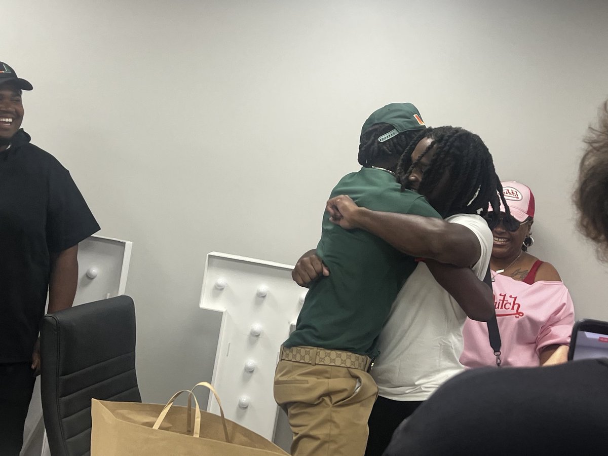 CaneSport's tweet photo. Malachi Toney with the big congratulatory hug for new Cane Commit A’Mir Sears https://t.co/RSvkVnJLym