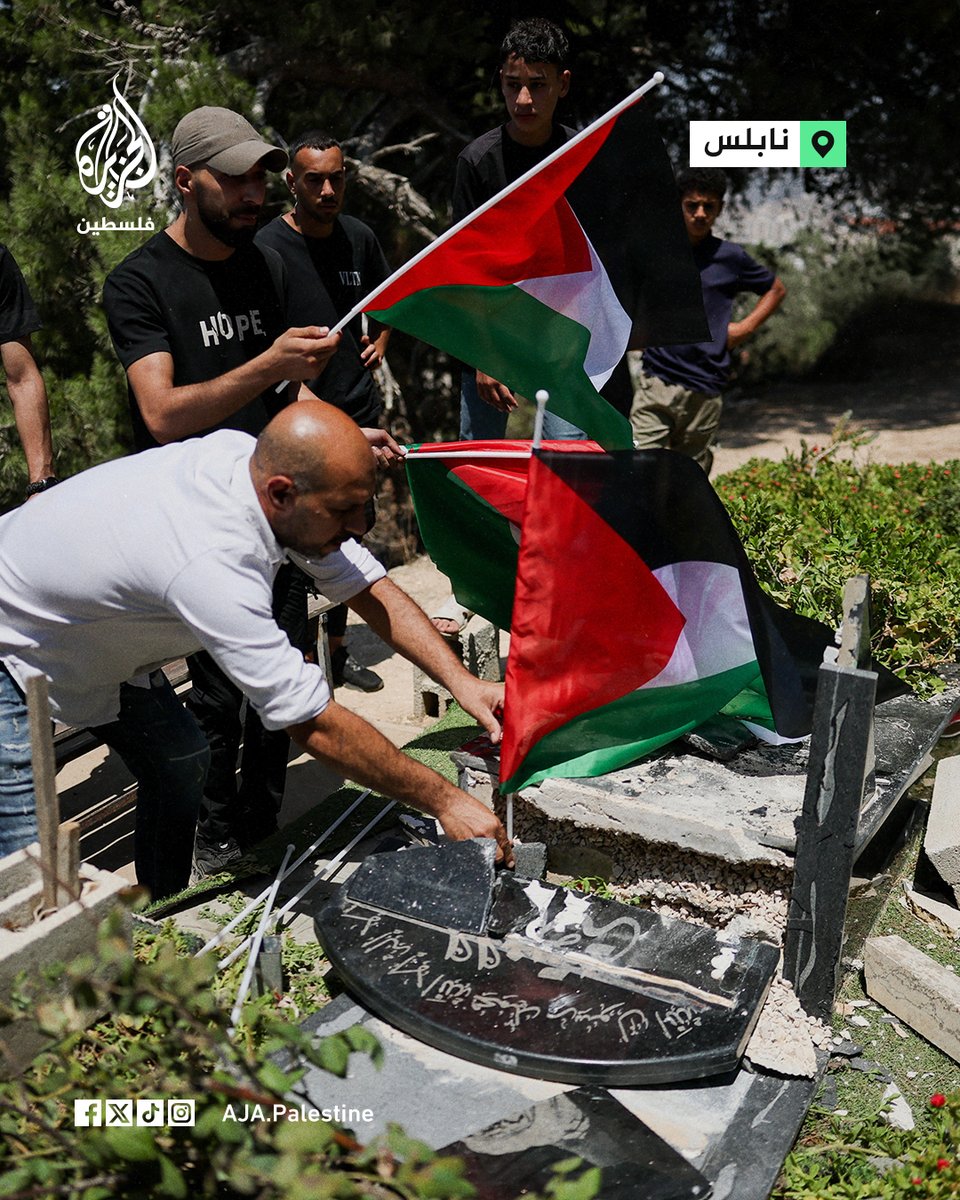 PalestineThred's tweet photo. A young man places a Palestinian flag on the grave of one of his relatives, after settlers vandalized several graves during their raid on villages in Nablus this morning.

#Photo
#Gaza_Palestine #Yemen_Sanaa #Iran_SaudiArabia #Urgent_Trump https://t.co/zTdpSqs9Zu