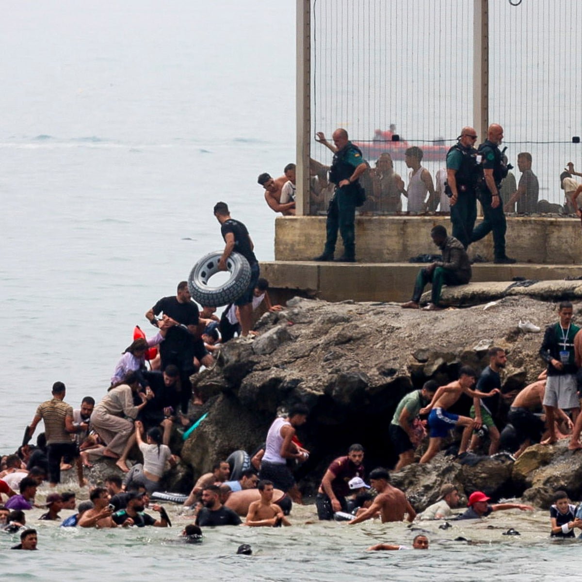 JChimirie66677's tweet photo. Spain Trained The Wolf That Is Now At Its Door

In 2021, Morocco funnelled 8,000 migrants into Ceuta as punishment over the Western Sahara dispute. Spain's policy on Western Sahara changed not long afterwards. That sequence is the whole story of this week, condensed into one sentence. A state used migrants as a weapon, the target government moved, and the lesson landed exactly as intended.

So when Pedro Sánchez pursued gas deals with Algeria, Morocco's rival, and Rabat grew frustrated, it reached for the same tool. Only this time at nearly eight times the scale. Sixty thousand people crossed into an enclave of 84,000 inhabitants in under 48 hours. At least 57 died. Western intelligence sources believe Moroccan authorities facilitated it, video shows their gendarmerie standing by as trucks disgorged young men near the border, and Spanish guards described their counterparts as "totally inactive" throughout. Sánchez's government did not treat this as an attack. It thanked Rabat for its "co-operation."

Spain built the exploit into its own law before Morocco ever used it. A Supreme Court ruling last month decided that migrants who swim into Ceuta cannot be subject to fast-track return, only those who cross the land fence. That ruling is the precise gap this week's crossing was engineered to test. Tellingly, 48,000 of the 60,000 who arrived had already gone home by Friday night, evidence that most weren't fleeing anything, they were chasing a rumoured loophole, encouraged along the way by traffickers and, on the available footage, by Moroccan police. A government whose own courts hand smugglers a script, and whose president thanks the neighbouring state that exploited it, has not been ambushed. It built the door.

Giorgia Meloni's response is the instructive contrast. Within hours she was threatening to suspend Schengen between Italy and Spain, treating uncontrolled entry as the security threat it plainly is. Whatever the merits of that specific measure, and Italy's own record on migration invites its own scrutiny, it is a government visibly weighing a real trade-off and choosing to act. Sánchez, so far, has chosen the comfort of understatement.

Britain should recognise this story, because it is living a slower version of it. Spain's exploit is one court ruling. Britain's is a system of them: an asylum appeals backlog approaching 100,000, a safe countries list that quietly excludes Afghanistan, Iran, Syria and Somalia, deportation powers used at half the rate Blair once used them, and a £10bn accommodation contract running to 2039 that no government signs for a population it intends to remove. Spain rewards Moroccan "co-operation" with silence. Britain rewards France's collapsing interception rate, down from 46.9 per cent to 33.1 per cent since 2023, with over £1bn and counting. Both governments are paying a counterparty to produce the opposite of what they claim to want.

The difference is pace, and it is not a difference in Britain's favour. Ceuta forces a reckoning in 48 hours, with images no minister can talk past. Britain's failure arrives in monthly tallies and quiet transfers from hotels into permanent housing, nothing dramatic enough to detonate into a crisis a government must answer for in public. A slow-motion version of the same weakness is not the milder case. It is the more durable one, because nothing about it is loud enough to make anyone stop.

Morocco taught Spain that migration works as leverage, and Spain paid the tuition twice. Britain has been paying the same tuition for a decade, to smugglers, to France, and increasingly to itself, and has yet to notice it is enrolled in the same course.

"Britain should recognise this story, because it is living a slower version of it. [...]. The difference is pace, and it is not a difference in Britain's favour."