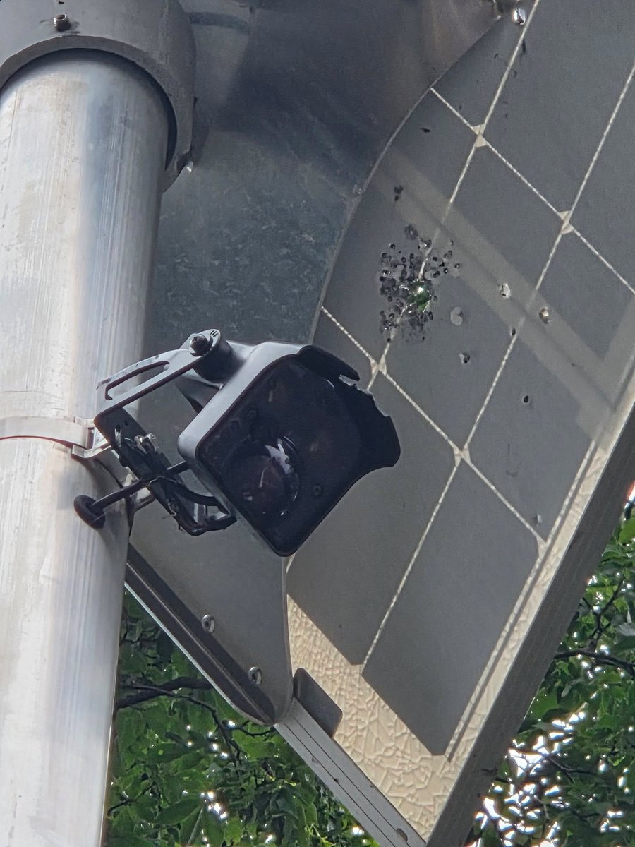 WaukeshaAlerts's tweet photo. The Town of Mukwonago Police is looking for assistance in finding the suspect who shot a solar panel and a sensor camera that alerted approaching drivers of a dangerous intersection.

The uneducated and quite stupid individual who did this appears to have mistaken the camera and solar panel for a flock camera, which look nothing like this. I am impressed at the stupidity of the suspect who did this not knowing what a flock camera actually looks like. 

The Town of Mukwonago does not have any flock cameras in their jurisdiction and do not participate in the program. 

If you have any information on the suspect who did this damage please call Mukwonago Police.