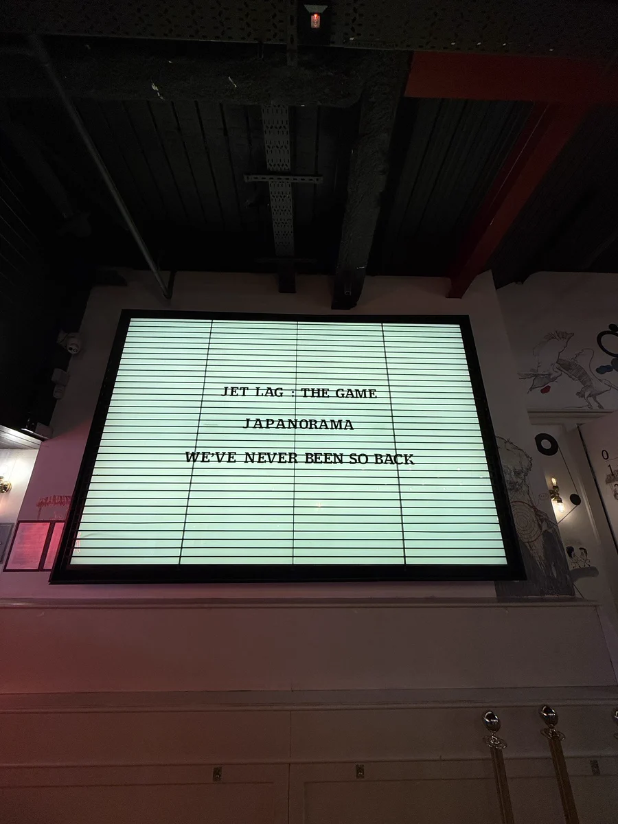 A marquee with text that reads “Jet Lag: The Game Japanorama We’ve never been so back.”