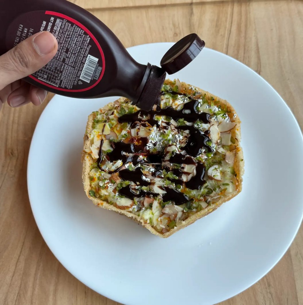 Swiggy's tweet photo. malai ghevar with chocolate syrup >>>> https://t.co/LeXvPOV3Xf
