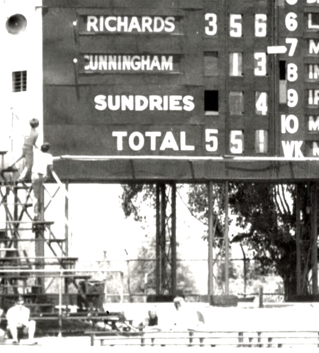 GeorgeByron1's tweet photo. Two schoolboys, seen on the left, climb terracing to get a better view of a historic Perth scoreboard displaying a monumental Barry Richards innings of 356 @fh_stephen @FertangFre62008 @gulu1959 @GeorgeDobell1 @barneygirnun @SACricketTeams @PictureSporting https://t.co/XkPmrbnJbX