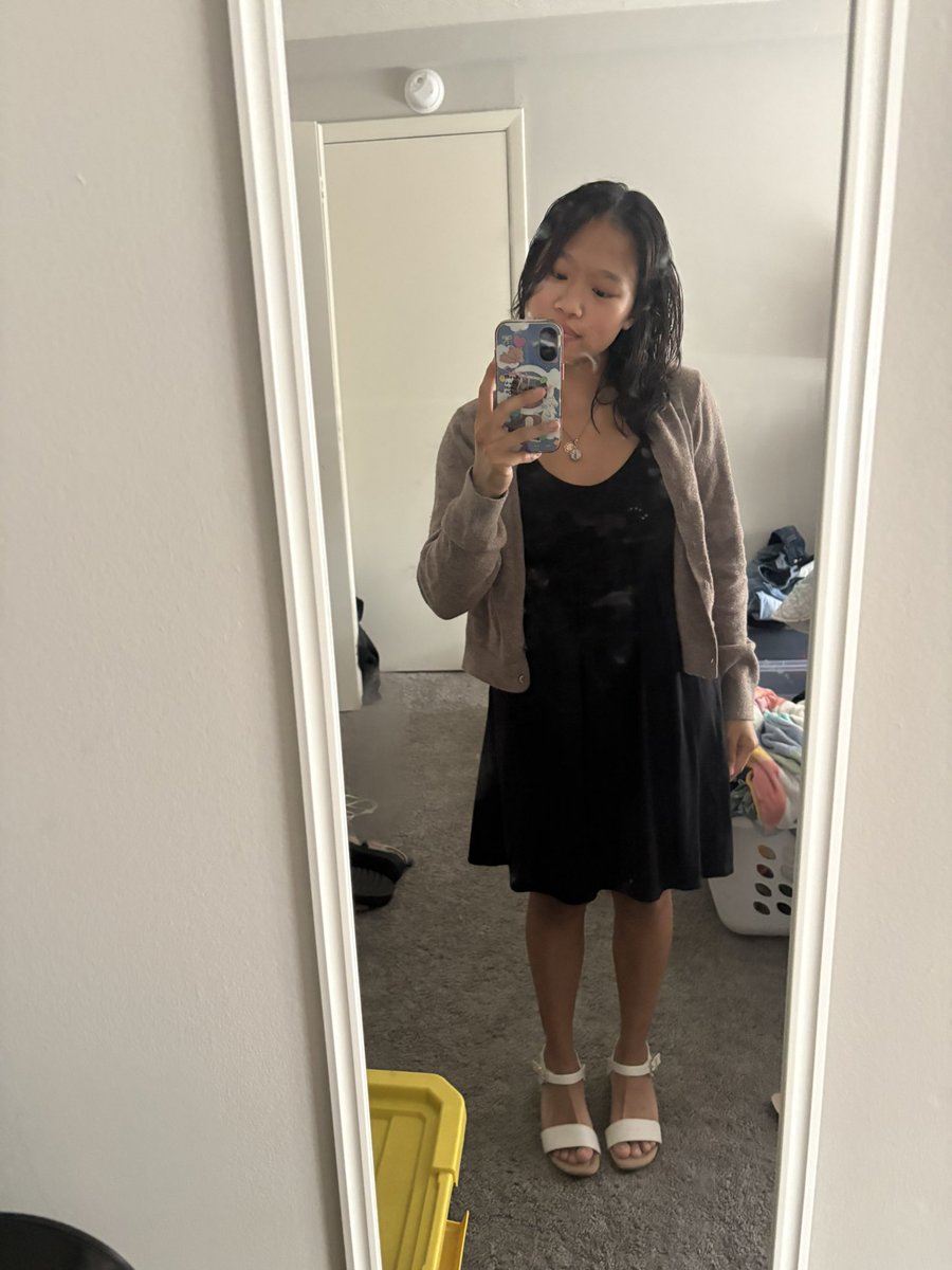 madswbb's tweet photo. ignore the shoes i was trying on a different dress for a wedding i'm going to. also ignore the dirty mirror, but this is the outfit i'm going with! just a plain black dress and beige cardigan https://t.co/4BQfqIcPU5