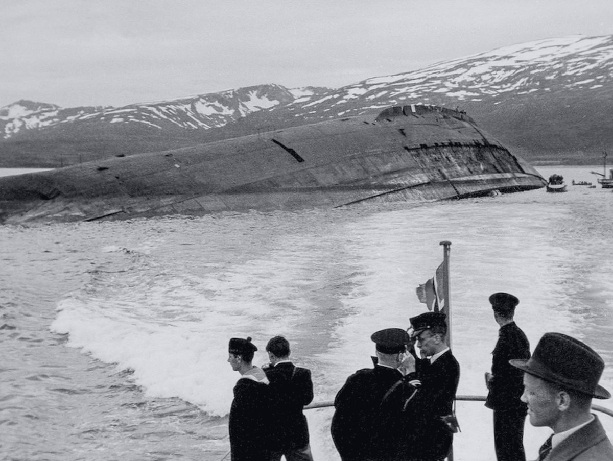 DramaWarship's tweet photo. Date: July 08, 1945. Location: 69°38′50″ N, 18°48′30″ E. Event: Sunk by the RAF bombers 8 months ago, former German battleship Tirpitz is visited by King Haakon VII of Norway. Current status: Scrapped in 1948-57, lifespan of 21 years. Photo taken on board motorboat Tusna. https://t.co/b2HLgICh5J