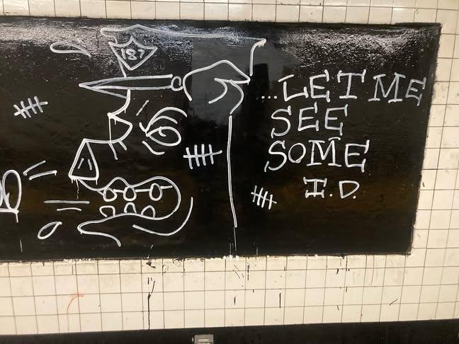 GraffitiRadical's tweet photo. "Let me see some ID"
Anti-cop graffiti seen in the NYC subway https://t.co/oqlqkQdRLK
