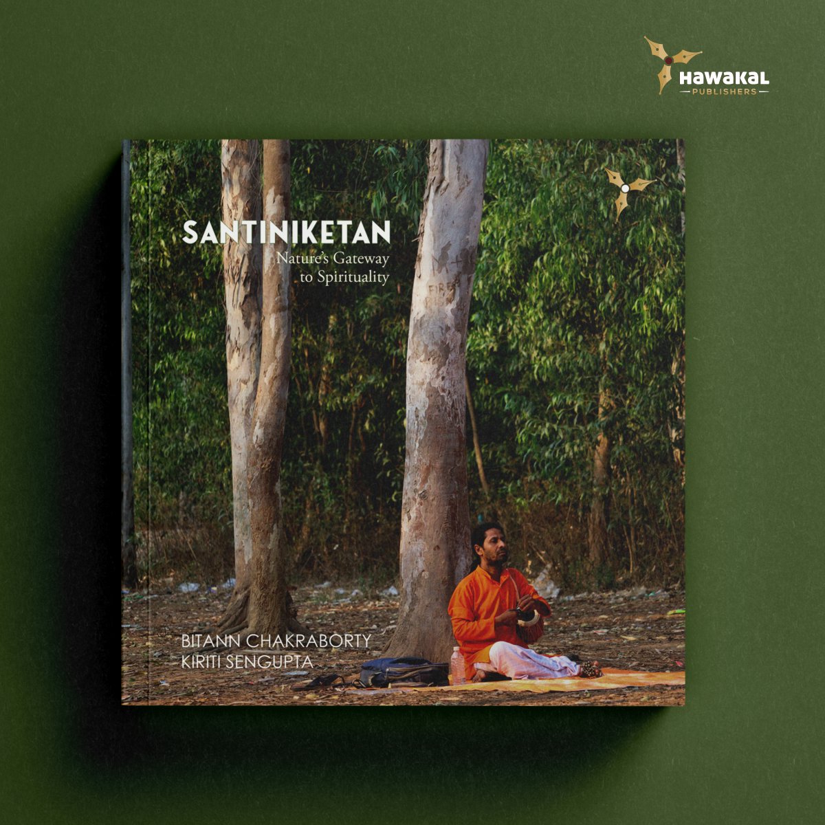 KiritiSKiriti's tweet photo. #NewReleaseAlert
Like other towns in the Birbhum district of West Bengal, Santiniketan is not merely about gods and goddesses, though a few major temples nearby, including Kankalitala and the Dangali Kali Mandir, attest to this. It is a humble yet rich sanctuary of Nature, abundant even now — humble because it coexists peacefully with humans, offering them the chance to live harmoniously in its embrace, and ever attentive to its genuine admirers. In December 1901, Tagore initiated Brahmacharyasrama, which was renamed Patha-Bhavana in 1925. Inspired by ancient Indian tapovan traditions, he established an open-air educational system that emphasised experiential learning. Tagore viewed Nature as both a teacher and a dynamic classroom. Santiniketan: Nature's Gateway to Spirituality is an endeavour to discover the divine within Nature and in modern life, conveyed through photographs accompanied by prose and poems.
Presenting one of Hawakal's most ambitious projects — a square, all-colour paperback — Santiniketan: Nature's Gateway to Spirituality — authored by Bitann Chakraborty and yours truly. While the book is scheduled for release on Aug 11 in India, it is now available overseas. So, please get a copy on Amazon.
#Photobook #Poetry #Santiniketan #RabindranathTagore #Tagore #Nature #Earth #Soil #Water #Trees #EcoLiterature #EcoCriticism #CoffeeTableBook #Hawakal #HawakalPublishers