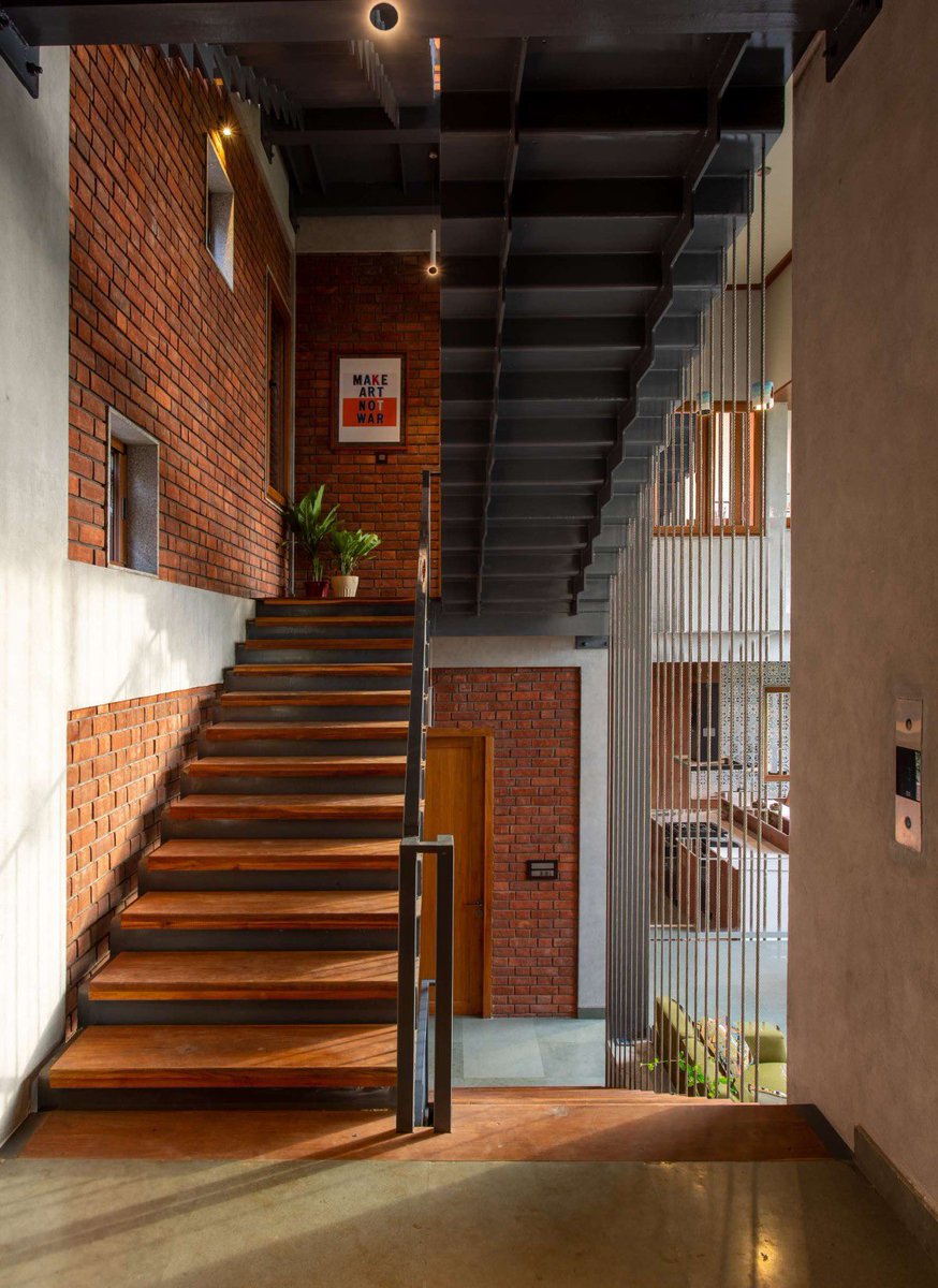 shavnyuyngah's tweet photo. A father in Chennai gave his daughter a house as a wedding gift. The architects built it almost entirely from brick, and used that “primitive” material to solve a problem glass and concrete usually can’t.

The Gully Home sits on an east facing plot overlooking the Bay of Bengal, meaning it takes the full force of the morning sun in exchange for the ocean view. ED+ Architecture’s answer was a double skinned facade: porotherm blocks on the inside, half cut bricks on the outside, cooling the interior while trapping heat in the wall itself rather than passing it through. Every window pairs an inward glass shutter with an outer aluminium louvered one, giving residents six different combinations of light, view, and airflow depending on the hour.

Inside, a triple height great room named after old Chennai’s street life pulls every bedroom’s bay window toward it, so the house stays visually connected floor to floor. The roof slab is layered with terracotta pots as fillers, cutting the concrete needed and the heat it would’ve absorbed.

Nothing about it reads primitive. It reads solved.

The Gully Home | ED+ Architecture
Chennai, India | 2022 | Photography: BRS Sreenag