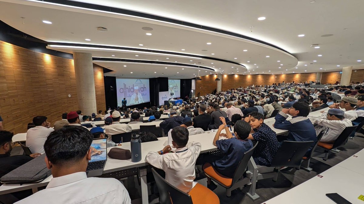 TahirulQadri's tweet photo. Al-Hidayah Canada 2026 Opens with Shaykh-ul-Islam Dr Muhammad Tahir-ul-Qadri’s Landmark Lecture on Humanity, Morality and Spiritual Revival
Hamilton, Ontario (Canada): The inaugural al-Hidayah Canada 2026, the first-ever three-day residential, spiritual and educational camp of its kind in North America, at McMaster University. The event commenced with a profound keynote address by His Eminence Shaykh-ul-Islam Dr Muhammad Tahir-ul-Qadri upon the theme "From Humanity to Depravity: A Moral and Spiritual Descent”. Shaykh-ul-Islam presented a comprehensive Qur'anic framework explaining the nature of the human soul, the causes of moral decline, and the path towards spiritual purification and human excellence.
Opening his address, Shaykh-ul-Islam expressed heartfelt gratitude to Allah the Almighty for granting the opportunity to establish al-Hidayah in North America. He described the occasion as a historic milestone for Minhaj-ul-Quran International, expressing hope that the initiative would become a lasting institution for nurturing the spiritual and intellectual development of Muslim youth across the continent.
He congratulated the leadership and volunteers of Minhaj-ul-Quran International Canada, Muslim Youth League, Minhaj Women League, Minhaj Welfare Foundation, Minhaj Sisters, and the entire organising team for their months of tireless dedication in making the event possible. He noted that many of the organisers had previously attended al-Hidayah camps in the United Kingdom and, inspired by their experience, resolved to establish a similar platform in Canada. Shaykh-ul-Islam prayed that this initiative would continue to flourish and eventually expand across North America, including the United States.
A particularly significant aspect of the event, he observed, was the remarkable participation of women. Congratulating Minhaj Women League and Minhaj Sisters, he highlighted the equal representation of men and women throughout the camp. Reflecting on nearly five decades of his mission, he stated that he had never witnessed women lagging behind men in commitment, service or organisational excellence. Rather, he noted, they had consistently stood shoulder to shoulder with men, and in many cases surpassed them in dedication and performance. He prayed that Almighty Allah accept the efforts of every volunteer and reward them abundantly in this world and the Hereafter.
Introducing the central theme of his lecture series, Shaykh-ul-Islam explained that "From Humanity to Depravity: A Moral and Spiritual Descent" is a subject he was presenting publicly for the first time in this systematic order and structure. Spread across three keynote sessions, the series explores how human beings gradually descend from the lofty station of humanity towards moral and spiritual corruption, identifies the signs of this decline, and presents the Qur'anic methodology for restoring human dignity and spiritual excellence.
The Dual Nature of Human Beings
Drawing upon the Holy Qur'an, Shaykh-ul-Islam explained that Allah Almighty has created human beings with both physical and spiritual dimensions, placing within every person two opposing capacities: the ability to ascend towards righteousness and the possibility of descending into corruption.
He explained that every individual possesses the potential to cultivate angelic qualities such as compassion, purity, truthfulness and obedience to Allah. At the same time, human beings also possess a lower self (nafs) that can become dominated by uncontrolled desires, animalistic instincts and satanic inclinations if left undisciplined.
According to Shaykh-ul-Islam, true human dignity lies not in suppressing natural instincts altogether but in bringing them under the discipline of divine revelation, moral consciousness, intellect and spiritual awareness. Human excellence is achieved when desires remain within the boundaries established by Allah.
The Qur'anic Principle of Free Choice
Quoting verses 8–10 of Surah al-Balad, Shaykh-ul-Islam explained that Allah has granted every person eyes, a tongue, lips, intellect and moral awareness, and has clearly shown humanity two distinct paths—the path of goodness and the path of evil.
He elaborated that the Qur'anic expression "An-Najdayn" signifies two elevated, clearly visible and unmistakable paths. Human beings are never left confused regarding truth and falsehood. Allah has made both routes evident, while granting every individual the freedom to choose between them through reason, conscience and free will.
He emphasised that moral character is shaped by personal choices, upbringing, environment, companionship and continuous self-training. The direction a person ultimately follows depends upon the decisions they repeatedly make throughout life.
Guidance Requires Purification
Referring to Surah al-Fatihah, Shaykh-ul-Islam explained that the Qur'an presents guidance as a comprehensive process consisting of both spiritual growth and purification.
He noted that following the path of the righteous alone is insufficient unless one simultaneously distances oneself from the paths that incur Allah's displeasure and those that lead people astray. Spiritual progress therefore requires not only adopting righteous influences but also actively removing the negative influences, sinful tendencies and destructive habits that corrupt the soul.
Quoting the Qur'anic declaration, "Successful indeed is the one who purifies the soul, and unsuccessful is the one who corrupts it," he emphasised that genuine spiritual success cannot be achieved without sustained self-purification (tazkiyah).
Moral Decline is a Gradual Process
A central focus of the lecture was Shaykh-ul-Islam's explanation that moral collapse never occurs suddenly but unfolds gradually.
He described the process beginning when a person repeatedly ignores the voice of conscience. Over time, desires replace divine guidance, sinful actions become habitual, excuses are created to justify wrongdoing, and sensitivity towards goodness steadily weakens. Eventually, repeated choices reshape human personality itself.
According to Shaykh-ul-Islam, human beings ultimately become what they consistently choose, practise and nurture within themselves. Human personality is therefore dynamic rather than fixed, continuously shaped by decisions, environment, companionship, education and moral discipline.
From Humanity to Animality and Depravity
Explaining the title of the lecture, Shaykh-ul-Islam distinguished between humanity, animality and depravity.
He stated that a person descends into animality when instincts begin governing life and higher moral faculties are neglected. This stage is marked by increasing domination of desires over reason and spirituality.
An even more dangerous stage is depravity, where intelligence itself begins serving evil desires. At this level, individuals not only commit wrongdoing but intellectually justify it, defend it, promote it and legitimise immoral behaviour.
Drawing upon the Qur'anic account of the creation of Prophet Adam (peace be upon him), Shaykh-ul-Islam explained that humanity possesses both earthly and spiritual dimensions. While the physical body is connected to material needs and worldly instincts, the divine spirit enables human beings to attain moral excellence, spiritual awareness and closeness to Allah. The lifelong struggle lies in ensuring that the spiritual dimension governs the material one.
Created in the Best Form—but Responsible for Maintaining It
Reflecting on Surah at-Tin, Shaykh-ul-Islam explained the Qur'anic declaration:
"Indeed, We created man in the best of forms; then We reduced him to the lowest of the low—except those who believe and perform righteous deeds."
He explained that being created in "Ahsan Taqweem" refers not merely to physical beauty but to the complete balance of human intellectual, moral, spiritual and physical capacities.
However, he stressed that this excellence is only the starting point, not a permanent guarantee. Using the analogy of a newly manufactured vehicle, he explained that while the Creator fashions humanity in perfection, maintaining that state depends upon human responsibility, discipline and obedience. Neglect, moral accidents and spiritual corruption are consequences of one's own choices rather than defects in the Creator's design.
Ghaflah: The Beginning of Spiritual Decline
Towards the conclusion of the first session, Shaykh-ul-Islam identified ghaflah (heedlessness of Allah) as the first stage of moral and spiritual decline.
He explained that when heedlessness enters the heart, truth, sincerity, accountability, modesty, generosity and moral responsibility gradually cease to guide human behaviour. Instead, life becomes dominated by bodily pleasure, selfish interests, worldly ambitions and unchecked desires.
Unless this decline is halted through repentance, self-accountability, moral discipline and spiritual training, it progresses from heedlessness to animalistic behaviour and ultimately to satanic depravity.
Shaykh-ul-Islam announced that the subsequent sessions of the lecture series would further explore the concept of ghaflah, its destructive consequences, and the Qur'anic remedies for restoring human dignity through spiritual purification, remembrance of Allah and moral transformation.
The opening keynote established the intellectual and spiritual foundation of Al-Hidayah Canada 2026, presenting participants with a deeply reflective Qur'anic understanding of human nature while outlining a practical roadmap for personal reform, character development and spiritual excellence in contemporary society.
Accompanying His Eminence Shaykh-ul-Islam were Prof Dr Hassan Mohiuddin Qadri (Chairman Supreme Council, MQI), Shaykh Hammad Mustafa al-Madani al-Qadri, Shaykh Ahmad Mustafa al-Arabi al-Qadri, Dr Faisal Iqbal Khan, Syed Shahzad Ali Faizi, Syed Saad Ali Faizi, Syed Soban Ali Faizi, Dr Ghazala Qadri (President of Minhaj-ul-Quran Women League International), and Baji Khadija Qurat-ul-Ain Qadri, each exemplifying leadership in the pursuit of authentic, scholarly Islam.
#AlHidayah2026 #AlHidayahWithDrQadri #LoveOfAllah #MinhajulQuran