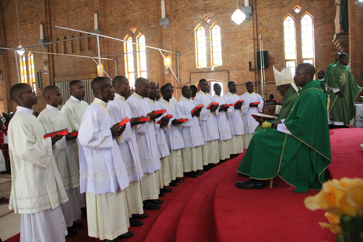 KabaleDiocese66's tweet photo. Earlier today, 20 Seminarians were installed as Lectors and Acolytes while two Seminarians were welcomed and admitted as candidates for Major Orders.

The lectors and Acolytes will be posted in different parishes across the Diocese for their pastoral spiritual year. While those admitted as candidates for Major porder will be ordained Deacons next year (God willing).

We thank Bishop Callist Rubaramira for predicting over this function and pray for the candidates to be led by the Spirit of God in their ministry.

A Lector is entrusted with proclaiming the Word of God during the liturgy and his main roles include: Proclaiming the Scripture readings at Mass (except the Gospel), Leading the Prayer of the Faithful when there is no Deacon, Directing the singing and participation of the faithful when necessary, Preparing other readers for the liturgy, Helping promote a deeper love and understanding of Sacred Scripture among the faithful. A lector is called to proclaim God's Word with faith, reverence, and clarity, recognizing that the Scriptures are living and active.

An Acolyte is instituted to assist the priest and deacon, especially during the celebration of the Eucharist and his responsibilities include: Assisting at the altar during Mass, Preparing the altar and sacred vessels, Serving as an Extraordinary Minister of Holy Communion when needed, Purifying sacred vessels where permitted by Church norms, Exposing the Blessed Sacrament for adoration (without giving Benediction, unless otherwise authorized), Coordinating and training altar servers, Fostering reverence and devotion to the Holy Eucharist. The ministry of acolyte emphasizes service at the altar and a profound love for Christ present in the Eucharist.

Both ministries are not merely functional roles but are ministries of service to the Church. Lectors serve Christ present in His Word while Acolytes serve Christ present in the Eucharist.
