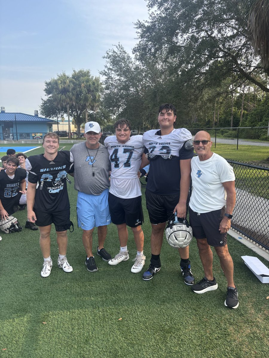 SRSabatalo's tweet photo. It was an action-packed first week of Fall Camp for the Ponte Vedra Sharks. Practice began each morning at 7:15 a.m. and ran through 9:30 a.m., progressing from helmets and shorts early in the week to helmets, shoulder pads, and shorts as camp advanced.
 
During the week, we also recognized senior defensive back Trey Butts, who was awarded the “Iron Sharpens Iron” T-Shirt. This honor is presented to the player who most consistently exemplifies the three DAWG Pillars—Conduct, Commitment, and Drive—through his daily actions and his commitment to making both himself and his teammates better throughout the spring and summer.
 
We also recognized all players who earned membership in the 600, 800, and 1,000 Pound Clubs based on their combined one-rep max totals in the squat, bench press, and power clean, which were tested the previous Monday and Tuesday. Players reaching a club for the first time will receive a T-shirt representing the level they achieved. In addition, players who recorded a power clean of 225 pounds or more will also be recognized with a special T-shirt for this outstanding accomplishment.
 
A special congratulations goes to our three members of the prestigious 1,000 Pound Club: seniors Sean Hassan and Carter Ottesen, who first reached this milestone in March and accomplished it again in July, an exceptional achievement requiring months of discipline and hard work and our newest member, junior Sam Racki.
 
Saturday provided an opportunity for our senior class to come together at Topgolf for an important leadership session. Each senior presented his personal Legacy Statement through a video slide presentation, sharing how he wants to be remembered by his teammates and coaches ten years from now. One of the most powerful lessons from the boys legacy statements was the understanding that every decision we make either strengthens or weakens our legacy.
 
Following the video presentation, the seniors enjoyed lunch and spent time together on the golf range continuing to build relationships, strengthen the team’s culture, and reinforce the importance of putting TEAM above self.
 
We look forward to another productive week as the Sharks transition into full pads and continue preparing with discipline, commitment, and grit for the season kick off classic against St. Augustine.