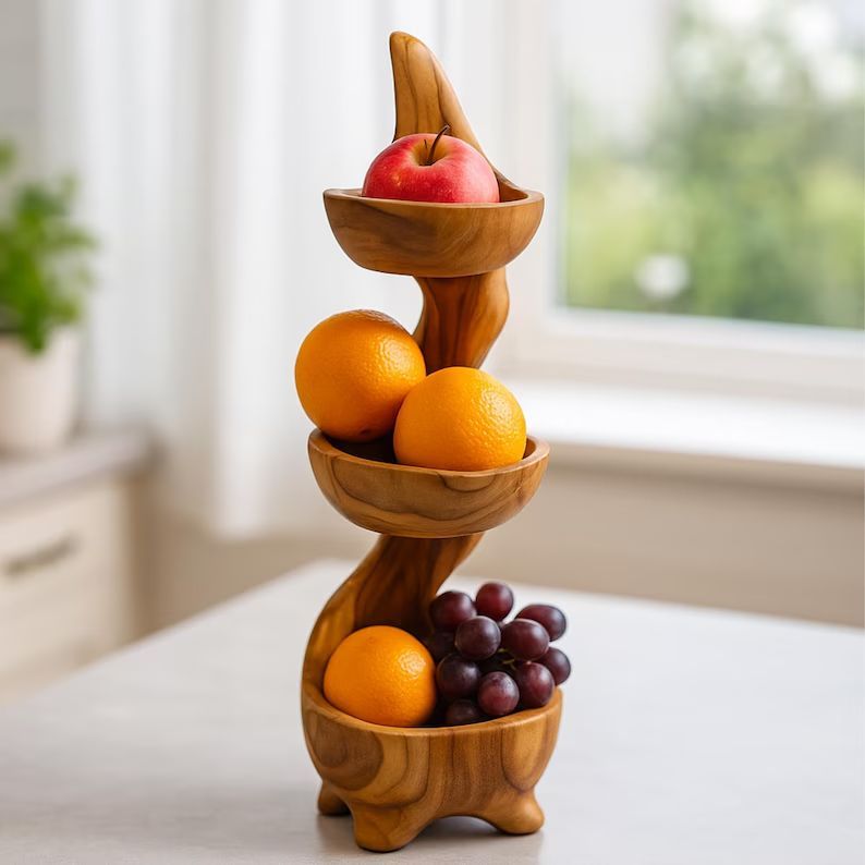dgkostop's tweet photo. 🍊 Display fruit, snacks or decorative accents with this handcrafted three-tier teak root stand. A functional centrepiece full of natural character.
https://t.co/vrvkSYb0Vl 
#EtsyUK #KitchenDecor #HandmadeHome https://t.co/JSv3F55C3B