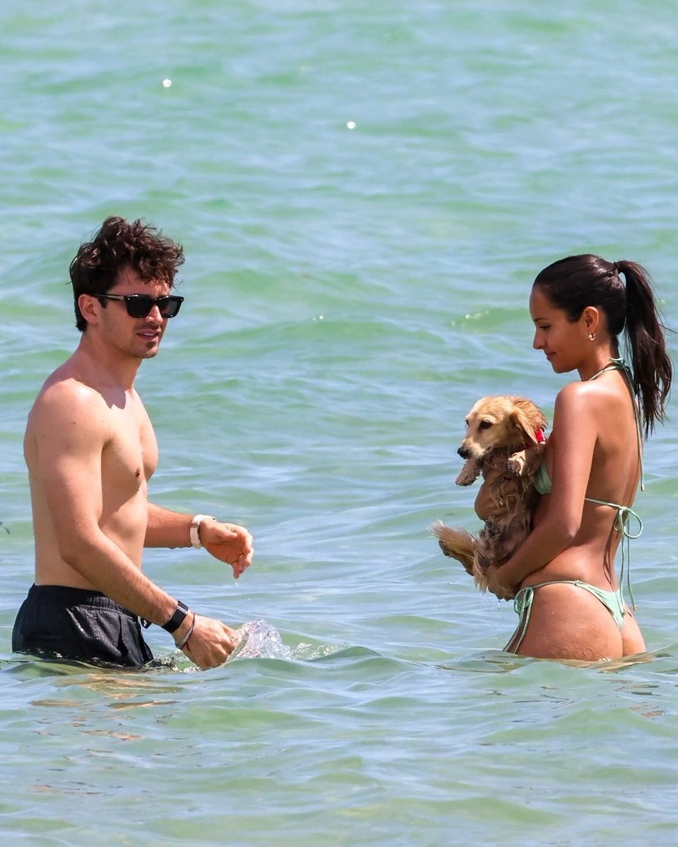 AnkitMi16412441's tweet photo. Ferrari Formula 1 driver Charles Leclerc enjoying a beach day in Miami with his wife, Alexandra Leclerc, and their miniature dachshund, Leo. https://t.co/aFgJFaLUNF