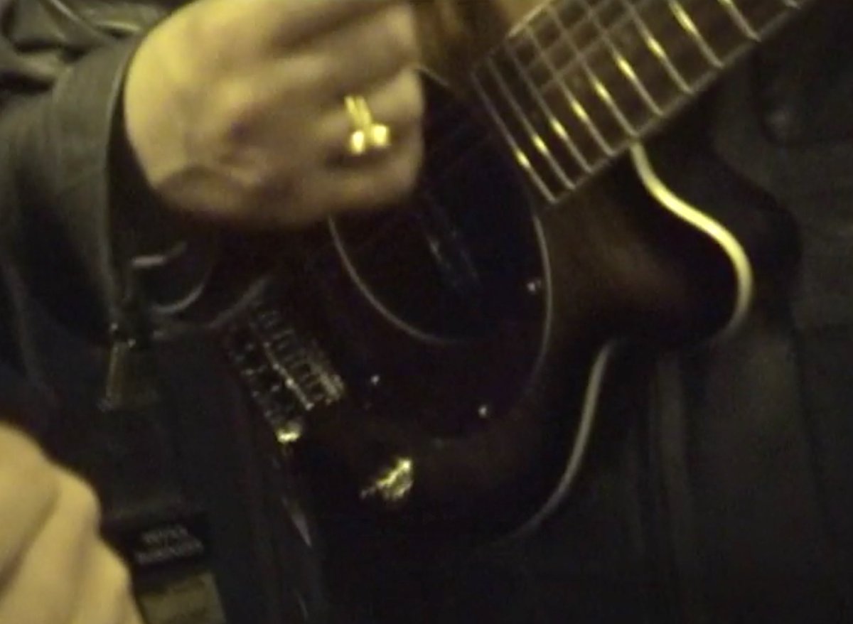 oasisvaults's tweet photo. liam playing a pignose guitar on the plane, March, 2000. https://t.co/yTOooo7jJG