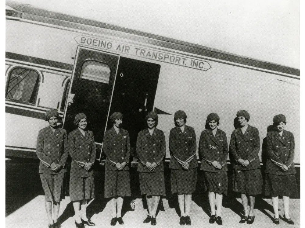 MCCCANM's tweet photo. If you aren’t aware, WestJet flight attendants are on strike. I don’t have all the details, but here are random semi-relevant things you can learn today:

The first FA served passengers on a Zeppelin in 1912, but it wasn’t really the same as today. Then, Stewards were introduced to serve passengers, though sometimes it was the copilot’s duty to go back & do so.

The role was generally for men only for some time after.

The first modern, female airline FA was a nurse & pilot named Ellen Church, who convinced Boeing (it was also an airline in those days & eventually became United Airlines) in 1930 to hire registered nurses to calm passengers & provide treatment if necessary. Since Stewards were the current thing, she became a “Stewardess”.

(The Stewardess title disappeared somewhere in the late 1970’s)

Ellen was grounded 18 months after due to a car accident, but she created a training program & recruited more nurses. It’s not unfair to say she was kind of the foundation.

It took some time, but airlines pivoted & began hiring only women for the FA role, based on trying to lure male business travelers. They could also pay them less; this was good news for an industry regulated by the government, which couldn’t compete based on fare prices, frequency or routes…so they competed based in part on the looks of their crew.

Early standards for FAs were strict. They had to be single, under 115 lbs, under 5’4” & had to retire upon either marriage or reaching the age of 32. They were sometimes called “Sky Girls” & the airlines marketed them heavily well into the 1970’s.

The first African American FA was hired in 1958.

The uniforms of FAs is a history all its own. You could spend days discussing it, so I won’t bother here, but it’s an interesting history…take a look! It’s originally based partly on the prestige of ocean liners; Pan Am was a leader in this field, dressing their crews as if they were the crew of a ship & calling the lead pilot a “Captain”. It took some wild turns after that, though…

In the late 1970’s, civil rights rulings forced the airlines to begin hiring men for the FA role again. The airlines were then also deregulated, which meant they could now compete based on fares, frequency & more routes…the result was a return to a business-style uniform.

The gay community had a kind of unique role in FA history once the airlines started hiring men. I’m afraid I am not the person to ask about this, I just think it deserves to be mentioned & really hope I haven’t written this in some offensive way. 

The number of flight attendants required for a flight depends on the number of passengers. I *think* it’s 1 FA for every 50 passengers. Then you need relief FAs if flights are over a certain duration.

Passengers can’t board until the minimum number of FAs are aboard. This can be a problem, as airlines need to maximize the productivity of FAs to keep fares low. Sometimes airlines keep a few FAs at the airport to start boarding while waiting for the assigned FAs; once the assigned FAs show up, the airport FAs leave. Or they might get the assignment if something goes sideways – they are packed & ready to go.

FAs don’t have the same rest & work rules that pilots do. They can generally work much more in a month, and rest periods can be shorter. FAs also aren’t required to retire at 65 like pilots are.

(Scheduling crews is incredibly complex. Most airlines don’t keep FAs & pilots together for entire trips, to maximize the productivity of crews. They don’t even necessarily keep the FAs together)

FAs are generally nice by training. They will be a completely different person if they have to do their real job in a crash. Fortunately, few ever see that.

FAs get a little training in fighting. I wouldn’t say it’s impressive training, though.

OK, that’s all I can come up with for the time being. Hope you enjoyed & learned something on a Sunday afternoon!