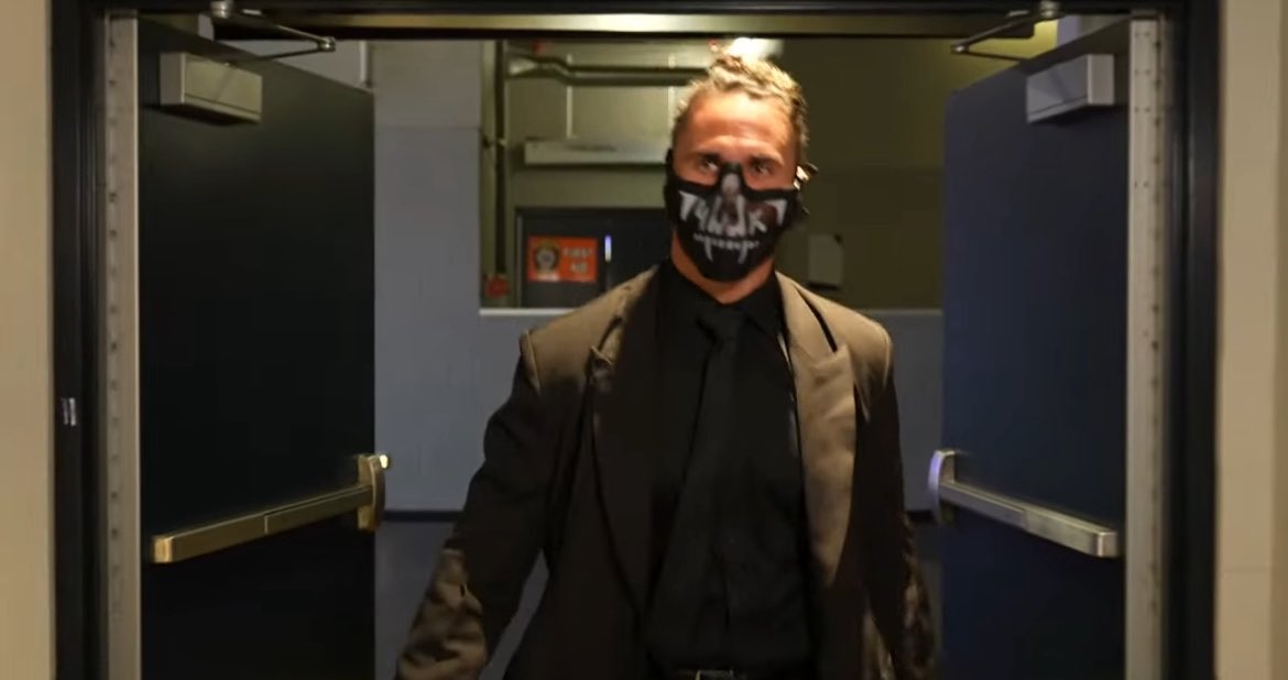 Fightful's tweet photo. Seth Rollins is wearing the Shield mask! https://t.co/jg7xwTmbBq