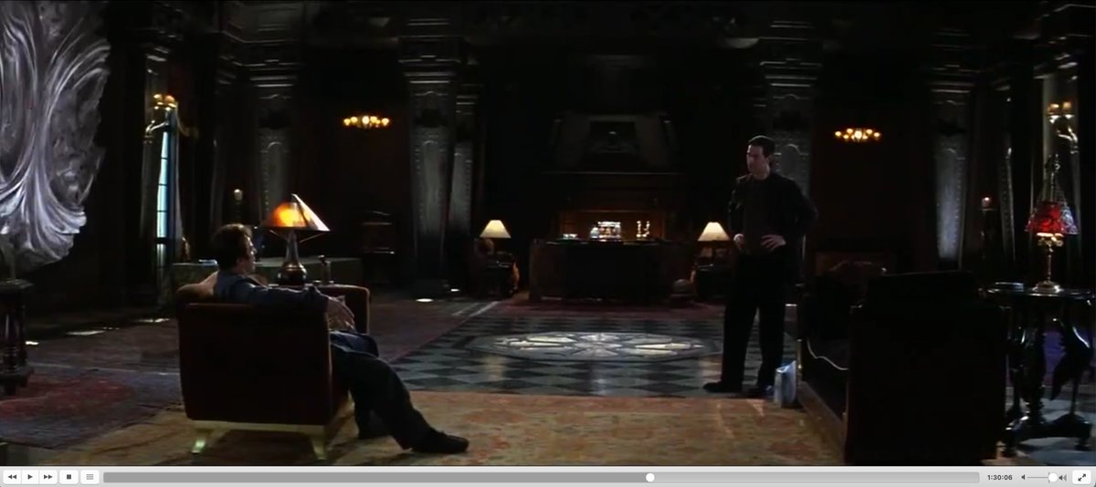A2Q93's tweet photo. The Devil's Advocate (1997) at 1:30:06 (136, 90m6s>96) shows pyramidion lamp, checker tiles and vortex artwork. https://t.co/qBKXe4taxe