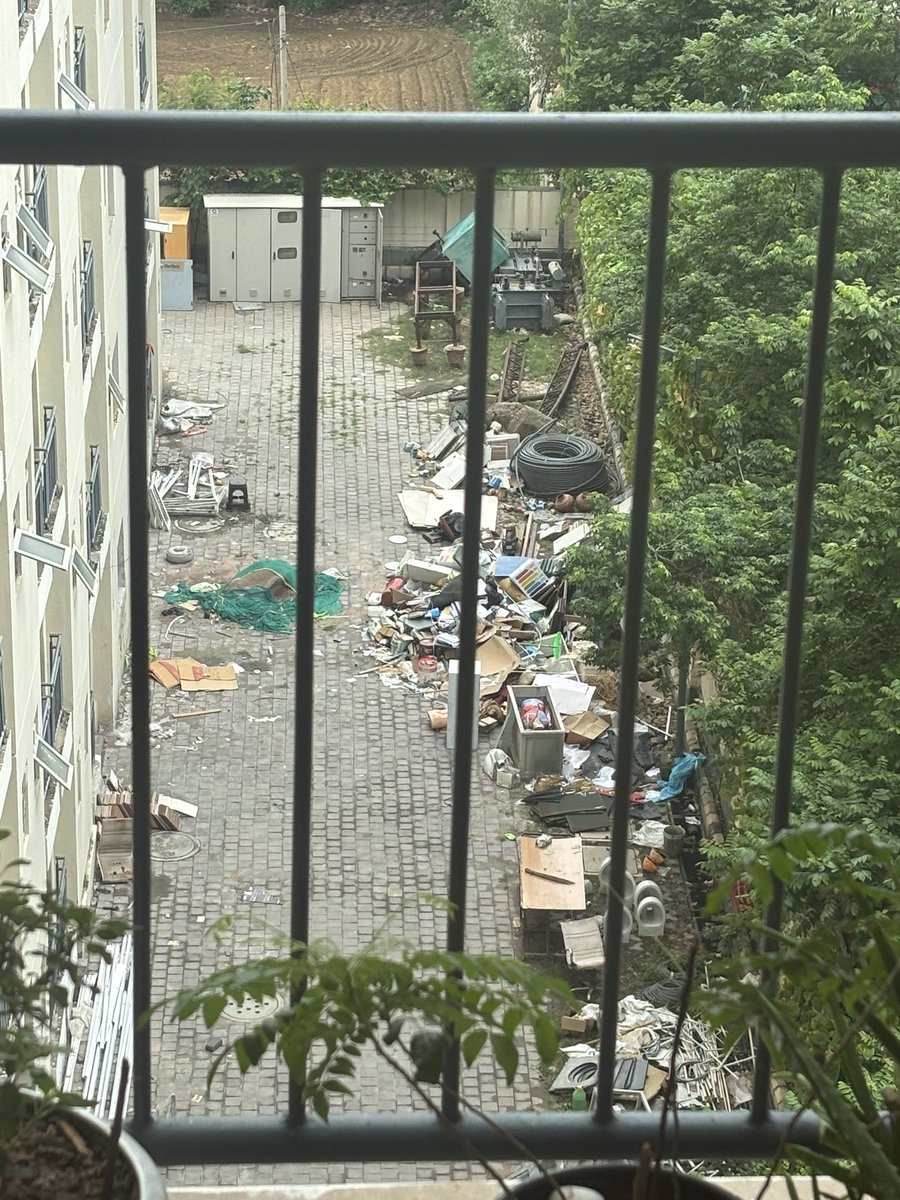 engineer_nancy's tweet photo. @GodrejProp this is how they are maintaining the society.. This is the front view from Balcony.. Despite saying multiple times, they are not removing this garbage and mess which is unhygienic and can give health issues https://t.co/ukDzijdX7H