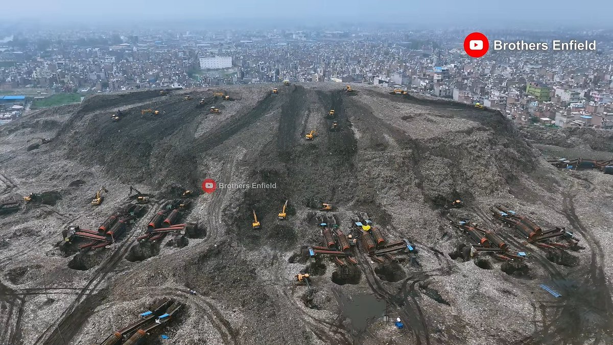 india_plus_'s tweet photo. 🚨 Delhi's Bhalswa landfill cleanup reaches halfway mark. 

Height reduced from 65m to 30m remaining, with completion targeted by December 2026. 

(📹 Brothers Enfield) https://t.co/IoFhkvTGU4