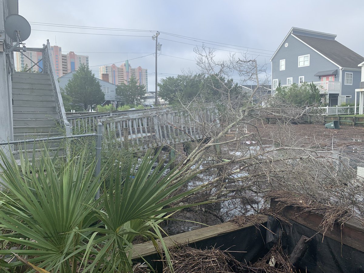 jamiearnoldWMBF's tweet photo. HURRICANE ISAIAS - 6 years ago today.  Because 2020 wasn't crazy enough, we needed a hurricane with an impossible to pronounce name.  Isaias made landfall at Ocean Isle Beach at 11:00 PM August 3rd, 2020 with winds of 90 mph.  A damaging storm surge occurred along the Horry County coastline during the evening high tide on August 3.  The middle portion of the Sea Cabin Pier at Cherry Grove was destroyed. Homes in low lying areas near the beach were flooded and dune erosion was severe.  Main Street between Ocean Blvd and Hillside Drive was closed due to flooding.  Sea Mountain Highway (SC Highway 9) was covered with 12 to 18 inches of water up to four blocks in from the beach.  In North Myrtle Beach water up to one foot deep reached about a block inland.  Ocean Blvd in Myrtle Beach was closed due to flooding for a time, and in Garden City North Waccamaw Drive was flooded and closed during high tide.  The storm was also devastating to the sea turtle nests with many destroyed.  100 sea turtle hatchlings died in the surge in Cherry Grove.   Despite the surge, peak winds in most of the Grand Strand only reached 40 to 60 mph as the core of the storm passed just off shore.

Damaging storm surge flooding continued northward along the south-facing coastline of Brunswick County including Holden Beach, Ocean Isle Beach, Oak Island, and Southport.  In Southport, extensive damage occurred to a hundred or more boats moored at the town's marina.  On Oak Island storm surge flooding damaged or destroyed an estimated 75-100 vehicles.  Sand dunes were washed onto streets up to three blocks inland.  

The storm surge moved up the tidal portion of the Cape Fear River into downtown Wilmington, causing significant street flooding and damaging some first-floor businesses along Water Street.  The downtown river gauge reached its highest level in history at 9.03 feet, eclipsing the previous record of 8.28 feet set just two years earlier during Hurricane Florence.

I snapped these pictures the morning after in Cherry Grove.
#SCwx #NCwx @wmbfnews
